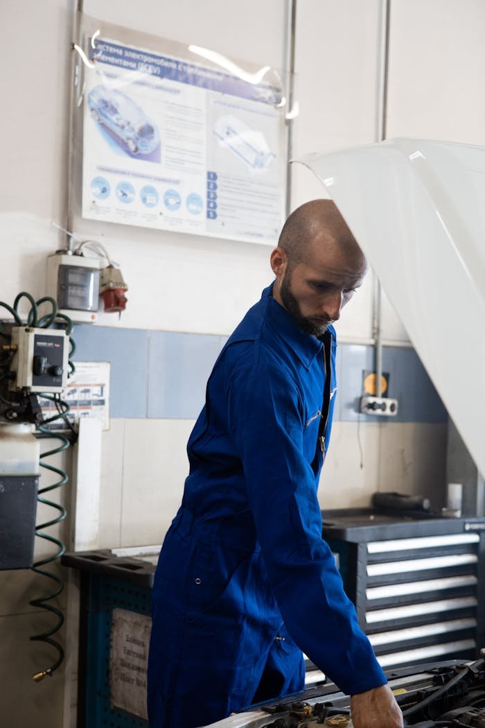 A Mechanic Inspecting a Car's Engine